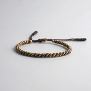 Bracelet Tibétain Tressé Noir et Jaune
